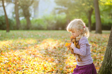 blond girl in autumn park