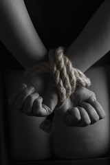 Fototapeta premium Nude submissive handcuffed woman, bondage act