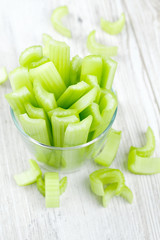 fresh celery sticks on wooden table