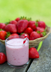 strawberry milk shake on wooden garden table