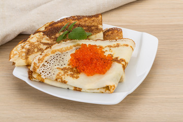 Pancakes with red caviar