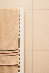 Bathroom heater with brown towels