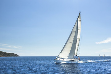 Fototapeta na wymiar Boat in sailing regatta in open Sea.