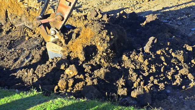 Excavator Dumps Gravel