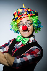 Funny clown against the dark background