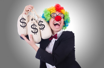 Businessman clown isolated on white © Elnur