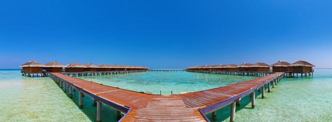 Bungalows on tropical Maldives island