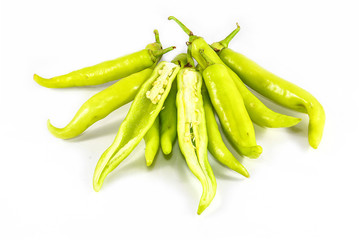 green sweet peppers on a white background
