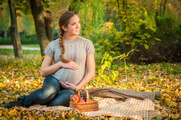 Pregnant woman in  park