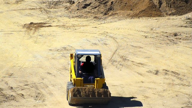 Bulldozer pushing dirt on construction site