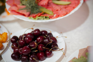 Festive table setting and decoration with fresh flowers and