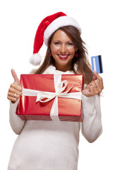 Smiling woman purchasing Christmas gifts