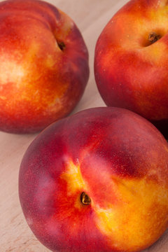 Three tasty fresh ripe juicy nectarines