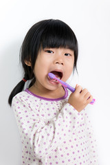 Child brushing teeth