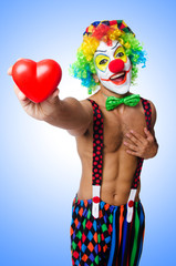 Clown with heart isolated on white