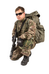 Soldier with rifle on a white background