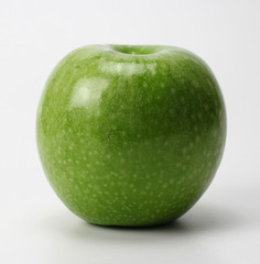green apple on a gray background