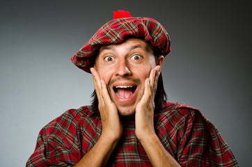 Funny scotsman in traditional clothing