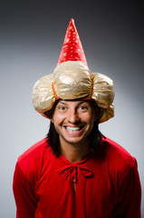 Funny wizard wearing red dress