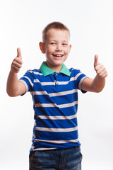 Portrait of happy boy showing thumbs up gesture,