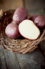 raw potatoes in a basket