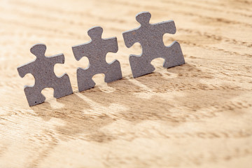 Three Jigsaw Puzzle Pieces on Table