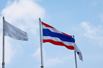 Flag of Thailand waving with blue sky
