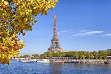Gardinen Eiffel Tower with a yellow tree on the front, Paris © bbsferrari
