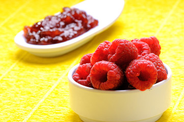 Fresh organic raspberry in basket. Selective focus