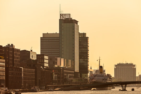 Sunset view of Amsterdam with modern buildings