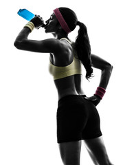 woman exercising fitness drinking energy drink  silhouette
