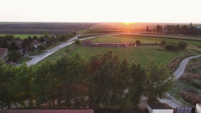 Flight over old mill during sunset