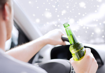 close up of man drinking alcohol while driving car