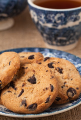 American cookies with chocolate and a cup of tea