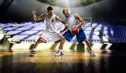 Plakat Two basketball players in action in the gym