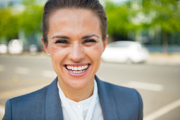 Portrait of smiling business woman in office district