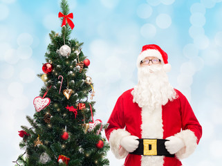 man in costume of santa claus with christmas tree