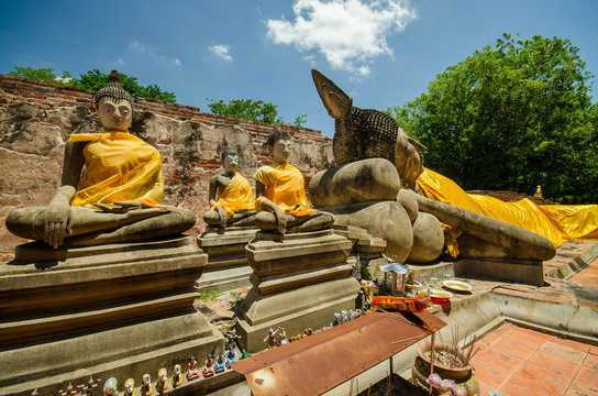 statue at reclining buddha in Wat Puthai Sawam Thailand