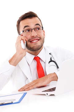 Doctor talking on the phone in the office