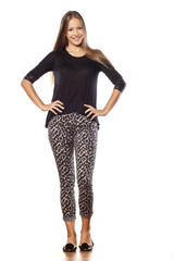 Smiling girl with long hair posing on white background