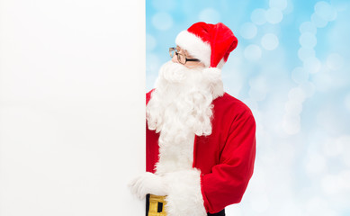 man in costume of santa claus with billboard