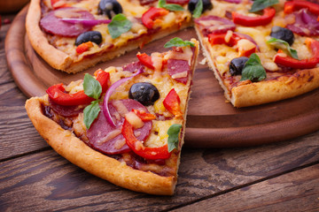  Pizza with tomato, salami and olives