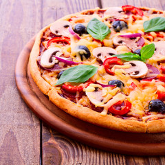 Pizza with tomato, salami and olives