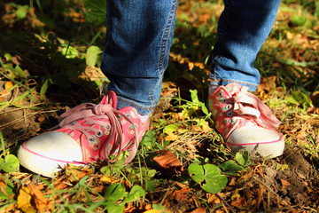 Colored shoes on the feet of the child.
