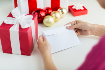 close up of woman with letter and presents