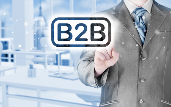 businessman pointing to word B2B