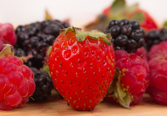 Mix of berries on a wooden table