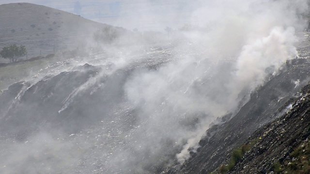 Trash landfill burning smoke