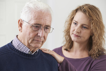 Serious Senior Man With Adult Daughter At Home
