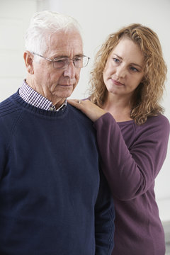 Serious Senior Man With Adult Daughter At Home